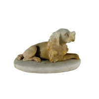 Picture Breton Epagneu dog figurine made of carved alabaster with amber patina
