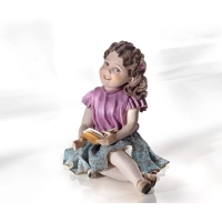 Picture Una hermosa muñeca de una niña leyendo un libro - Sibania