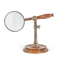 Picture A unique magnifying loupe on a wooden stand